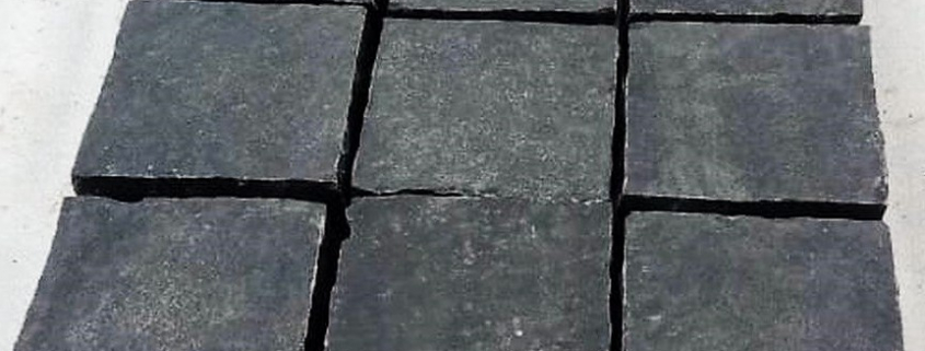 Black Limestone cobbles. Measuring 100mm x 100mm wide and 40mm - 60mm thickness. Price per cobble. THE BENEFITS OF USING BLACK LIMESTONE COBBLES FOR YOUR PROJECT When embarking on a project, one of the foremost basic decisions to be made is what building materials to use.  There is a lot of choice available when it comes to cobbles so lets look at some of the benefits of using black limestone cobbles. Cost Firstly when starting a new project, costs can be a major concern.  Using cobbles is an excellent choice for lowering expenditure on your project. These cobbles do not have any of the associated production costs attached to them that new materials do, allowing the prices to stay low. Environmentally friendly Secondly one of the largest advantages of using cobbles is that they are an environmentally friendly option. The construction industry in the UK is a huge contributor to national waste and carbon emissions. Such emissions can come from extracting, producing, manufacturing and transporting building materials. By using cobbles you can cut out a lot of this negative environmental impact as you are using pre-made materials, for instance. Adds character Thirdly using these materials for your project can be a fantastic way to add character and individuality. These materials can help create a unique finish, allowing you to make a truly original building. When used for paving, the variety of textures and tones available with cobbles are sure to create an attractive and eye catching finish.