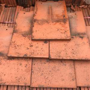 Reclaimed Rosemary smooth red clay roof tiles, machine made red / orange colour. Dimensions: 265mm x 165mm. Why Should I Choose Them? We think there are some major benefits to using Reclaimed Rosemary roof tiles.  They generally look better, especially on buildings that are very old.  We believe they add to the beauty of a property, often retaining its traditional look. Reclaimed tiles provide character, giving it a unique style. Reclaimed roof tiles are also environmentally friendly. This reduces the impact of having to source new materials, and stops materials ending up as landfill. They often end up working out as a cost effective alternative to other tiles. There is little need to worry about maintenance issues with reclaimed tiles, as the quality is often of high standards.